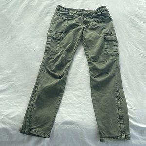 TNA slim, green Khaki pants, little stretch, Size 8, with pockets. Length 35.5